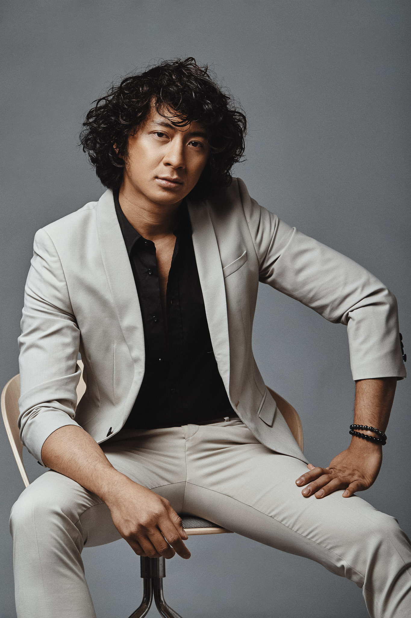 Man portrait on grey background. Studio photography.