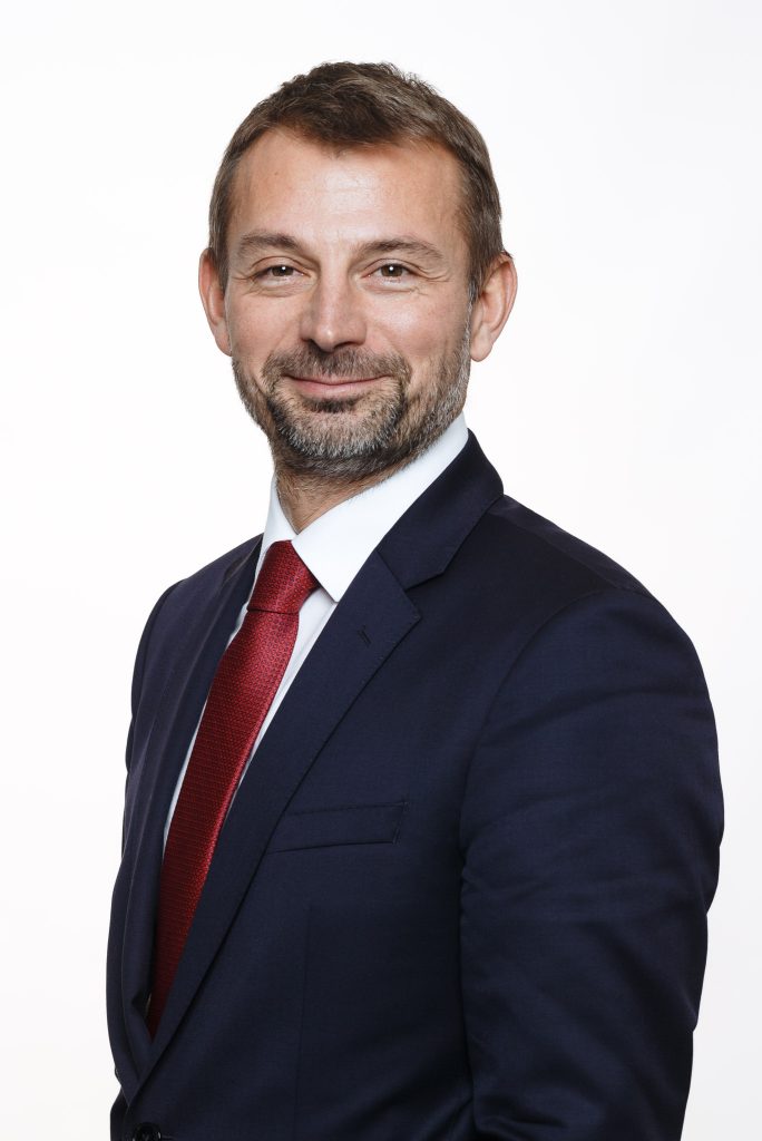Corporate Portrait of Riga's French Institut director on white background